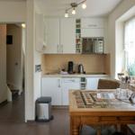 Kitchen with table, microwave, and dishwasher