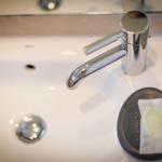 Sink with chrome faucet and soap dispenser