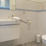 Bathroom with sink, mirror and toilet