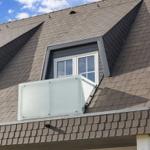 Skylight with glass balcony and sliding roof on gray roof