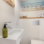 Bathroom with sink, seagull picture, and seagull decor.
