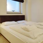 Bedroom with bed, nightstand, and window