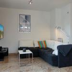 Living room with sofa, TV, and table