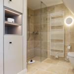 Bathroom with shower, toilet, and heater