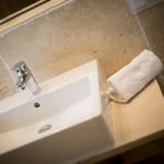 Sink with towel on stone countertop
