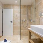 Bath with shower, sink, and heater
