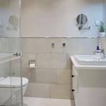 Bathroom with shower, toilet, and sink