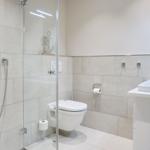Bathroom with shower, toilet, and sink