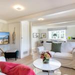 Living room with sofa, TV, and table