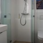 Bathroom with shower, toilet, and sink