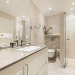 Bathroom with shower, sink, and toilet
