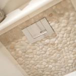Shower with stone tiles and modern shower area