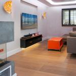 Living room with sofa, TV, and fireplace