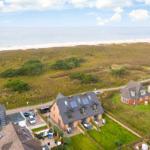 House with garden and view of beach and sea