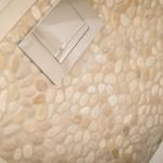 Bathtub with stone tiles and modern faucet