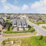 House with terrace and garden on quiet street with view of villages and dunes.