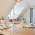 Dining table for four people, view of the beach.