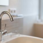 Sink with modern faucet and mirror