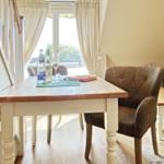 Dining table with chairs and window view
