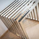 Metal radiator with horizontal bars mounted on wall