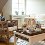 Living room with seating group, sofa and firewood