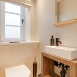 Bathroom with sink, mirror and window
