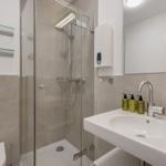 Bathroom with shower, sink and toilet.