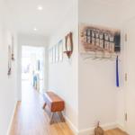 Hallway with wooden floor, wall art, and coat hooks on the wall