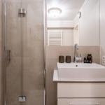 Bathroom with shower, sink and mirror