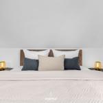 Bedroom with bed, pillows, and nightstands under sloped ceiling