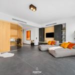 Living room with sofa, sauna, and plant
