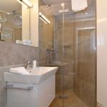 Bathroom with shower, sink and mirror