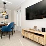 Living and dining area with TV and dining table.