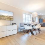 Dining room with table, chairs, and kitchen area