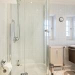 Bathroom with shower, sink and mirror