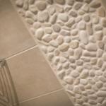 Shower wall with stone texture and chrome handle