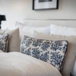 Bed head with pillows and duvet in neutral colors