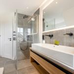 Bathroom with shower, sink, and toilet