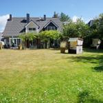 House with large garden and beach chairs