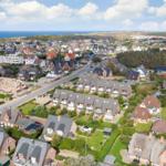 View of coastal town with houses and beach