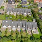 House with multiple apartments and large gardens in a quiet residential area.