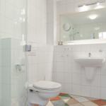 Bathroom with shower, toilet, sink, and bathtub.