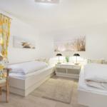 Two beds, nightstands with lamps, and window with yellow curtains.