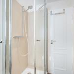 Shower cabin with shower head and door