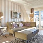 Living room with sofa, side table, and window with view.