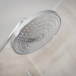 Shower head with multiple nozzles in a bathroom