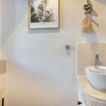 Sink with mirror and wall decoration