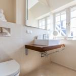 Bathroom with sink, mirror and window