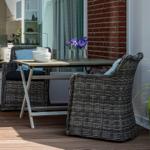 Terrace with table, two chairs, and flowers