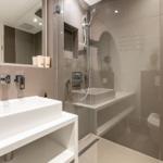 Modern shower with showerhead and sink in the bathroom